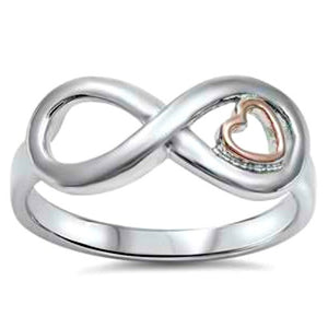 Womens silver infinity ring with tiny rose gold floating heart would make a cute midi ring, knuckle ring, or thumb ring 