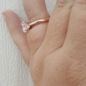 Rose Gold Solitaire Ring on finger side view