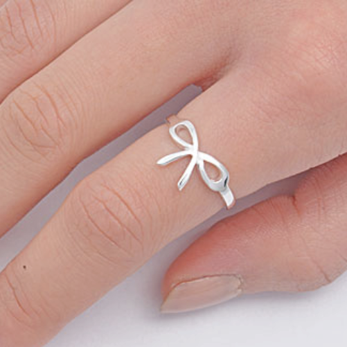 Bow tie ring on finger