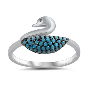 Style: Unique whimsical and elegant swan with turquoise stone body and clear white CZ eye gemstone accent  Metal quality: .925 Sterling Silver with stamped hallmark  Color: Blue, Black, Clear White  Stones: AAA Quality Russian Ice Cubic Zirconia  Stackable: Yes  Wear as: Kids fashion, Ladies Midi, Thumb, Knuckle, Regular  Face height: 10 mm high  Band width: 2 mm  Ring size: 4-10  Packaging: Comes in a pretty gift box  Made in the USA