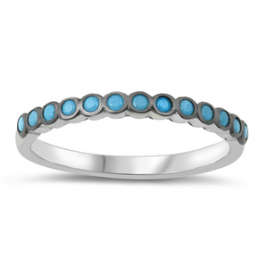 Style: Striking small circles set with blue turquoise gemstones in a black setting  Metal quality: .925 Sterling Silver with stamped hallmark  Color: Blue, Black  Stackable: Yes  Wear as: Ladies Midi, Thumb, Knuckle, Regular fashion  Face height: 10 mm high  Band width: 2 mm  Ring size: 4-10  Packaging: Comes in a pretty gift box  Made in the USA