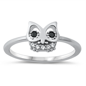 Style: Cute Owl with black eye gemstone accents  Metal quality: .925 Sterling Silver with stamped hallmark  Color: Silver, Black, Clear White  Stones: AAA Quality Russian Ice Cubic Zirconia  Stackable: Yes  Wear as: Kids fashion, Ladies Midi, Thumb, Knuckle, Regular  Face height: 9 mm high  Band width: 2 mm  Ring size: 5-10  Packaging: Comes in a pretty gift box  Made in the USA