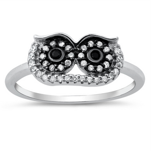 Style: Large Eyed Owl with gemstone and accents  Metal quality: .925 Sterling Silver with stamped hallmark  Color: Silver, Black, Clear White  Stones: AAA Quality Russian Ice Cubic Zirconia  Stackable: Yes  Wear as: Kids fashion, Ladies Midi, Thumb, Knuckle, Regular  Face height: 8 mm high  Band width: 2 mm  Ring size: 5-10  Packaging: Comes in a pretty gift box  Made in the USA