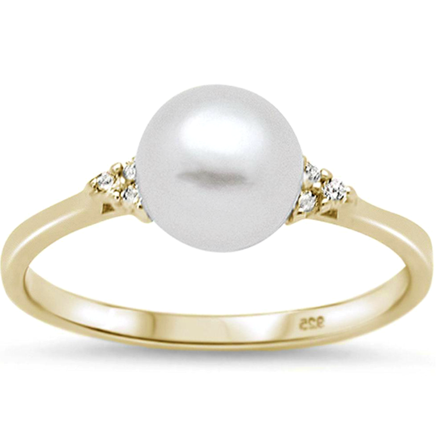 Womens perfect pearl in a warm yellow gold setting with triple gemstones on each side