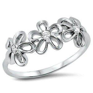 Flowering Daisies in a row in this girls and womens silver ring
